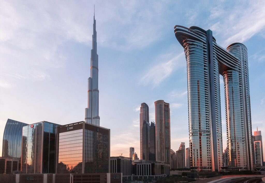 Stunning view of Dubai skyline with Burj Khalifa at sunset showcasing modern architecture.